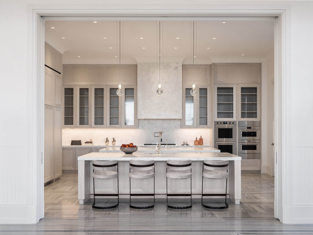 A modern kitchen from the Birds Street project designed by Coppel Design, featuring sleek cabinetry, high-end appliances, and a spacious layout that encourages both cooking and entertaining.