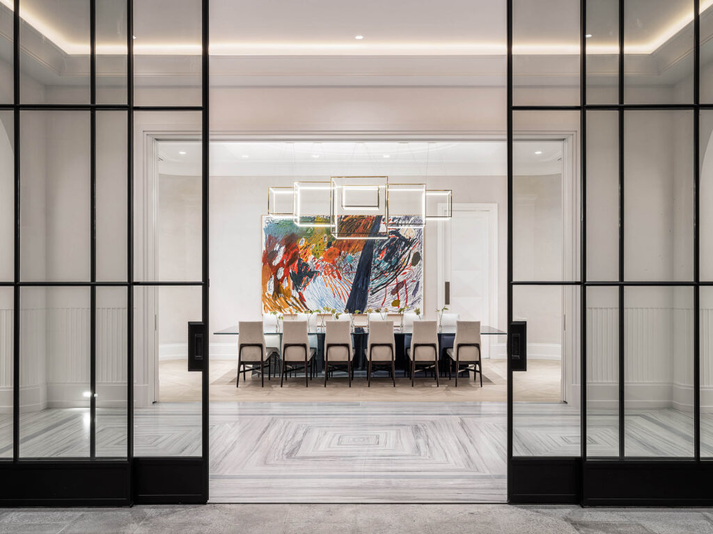 A modern dining room from the Birds Street project designed by Coppel Design, featuring an elegant dining table, stylish chairs, and sophisticated decor that creates an inviting atmosphere for gatherings.