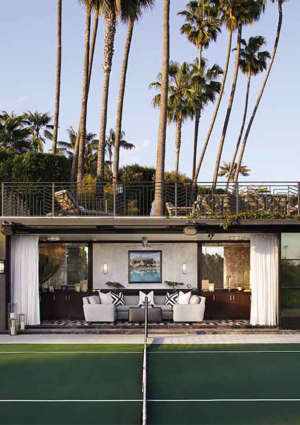 A modern luxury home designed by Coppel Design, viewed from the garden, featuring sleek architectural lines, expansive glass windows, and a seamless integration with the surrounding lush greenery and outdoor living spaces.